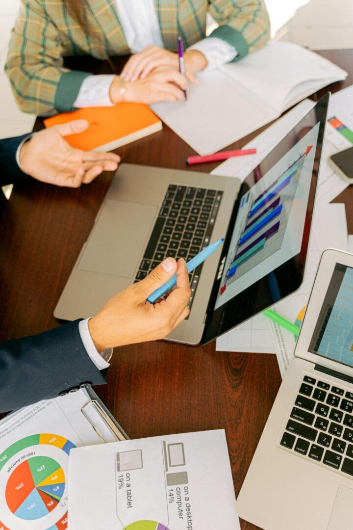 Free A Person in Black Suit Holding a Pen Stock Photo